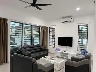 a living room with two chairs and a flat screen tv at LOW SEASON PROMOTION! 4B12B Mountainville Bungalow in Ipoh