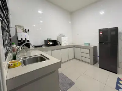 a kitchen with a sink and a black refrigerator at LOW SEASON PROMOTION! 4B12B Mountainville Bungalow in Ipoh