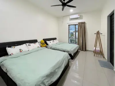 a bedroom with two beds and a ceiling fan at LOW SEASON PROMOTION! 4B12B Mountainville Bungalow in Ipoh