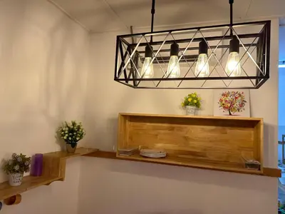 a chandelier hanging over a counter in a room at Ipoh Family Masjid Muhammadiah Evicharger SY15 in Ipoh