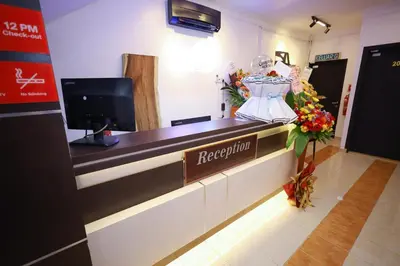 a reception desk with a dress on a mannequin at RENTIO HOTEL in Kulim