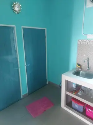 a bathroom with a sink and a sinkessment at Rumah Kebun by Panorama Homestay in Lambor Kanan