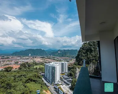 a view of a city from a balcony of a building at Jomstay The Cove Ipoh Hillside Residence in Ipoh