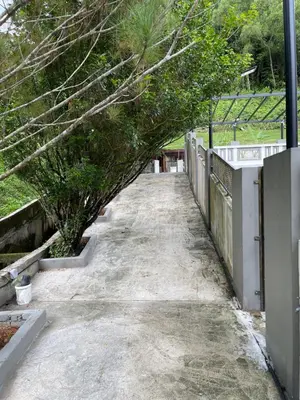 a sidewalk with a tunnel of trees on it at 15PAX 3 BR, Kids Swimming Pool, Pool table, BBQ near Spice ARENA, Airport Penang in Bayan Lepas