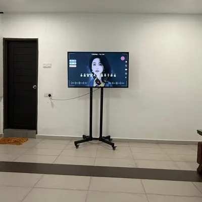 a flat screen tv on a wall in a room at 15PAX 3 BR, Kids Swimming Pool, Pool table, BBQ near Spice ARENA, Airport Penang in Bayan Lepas