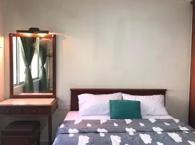 a bedroom with a bed and a dresser and a mirror at Natural Paradise 3Mins to Beach at Teluk Batik Lumut in Lumut