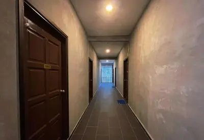an empty hallway with a door and a hallwayngth at Pangkor Nature View House in Pangkor