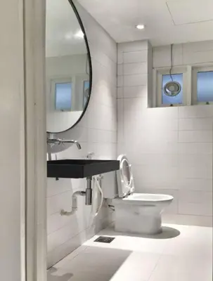 a bathroom with a sink and a toilet and a mirror at 80 Colonie Fraser's Hill 16 Pax in Bukit Fraser