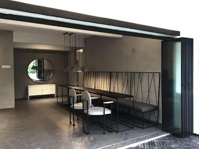 a dining room with a table and chairs and a mirror at 80 Colonie Fraser's Hill 16 Pax in Bukit Fraser