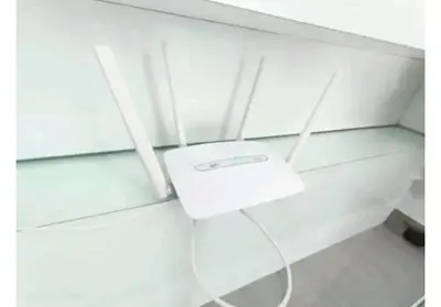 a white router sitting on top of a glass shelf at City Town 2-6 Pax Beautiful View Cozy Condo, Jelutong, Georgetown, Centre Heart Of Penang Island, near Highway Komtar Gurney in George Town