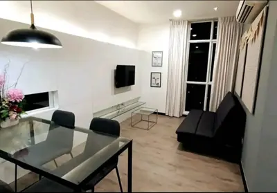 a living room with a glass table and a couch at City Town 2-6 Pax Beautiful View Cozy Condo, Jelutong, Georgetown, Centre Heart Of Penang Island, near Highway Komtar Gurney in George Town