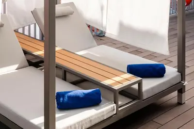 two blue pillows are sitting on a bench at Citadines Connect Georgetown Penang in George Town