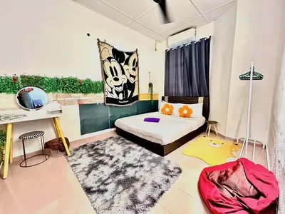 a room with a bed and a mirror in it at Cozy 255 Entire 3 Bedroom House At Alma Bukit Mertajam in Bukit Mertajam