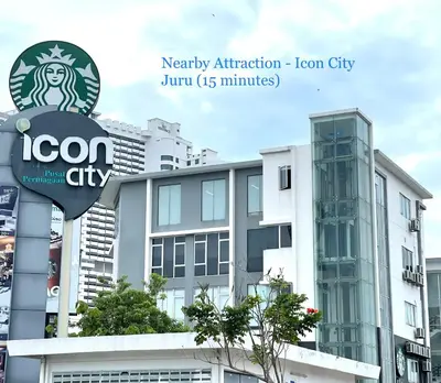 a building with a sign in front of it at Cozy 255 Entire 3 Bedroom House At Alma Bukit Mertajam in Bukit Mertajam