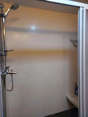 a bathroom with a shower stall with a shower at Batu Ferringhi Luxury Seaview Suite - 3Br in Batu Ferringhi