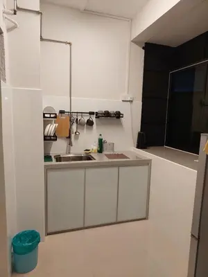 a kitchen with a sink and a counter top at Batu Ferringhi Luxury Seaview Suite - 3Br in Batu Ferringhi
