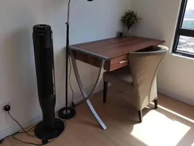 a desk with a television and a chair in a room at Lovers under Cupid's Arrow 丘比特之箭下の恋人 in Butterworth