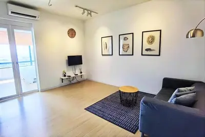 a living room with a couch and a table at Lovers under Cupid's Arrow 丘比特之箭下の恋人 in Butterworth