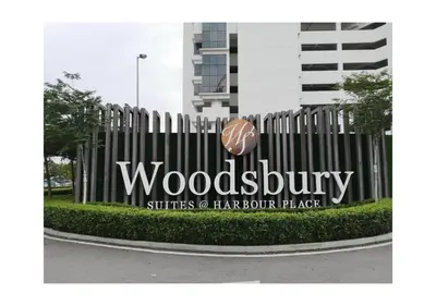 a sign for a woodenbury sits in front of a building at Blue Aesthetic Luxury Seaview 3 min Drive Sunway in Butterworth