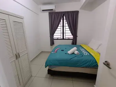 a bedroom with a bed and a window at Blue Aesthetic Luxury Seaview 3 min Drive Sunway in Butterworth