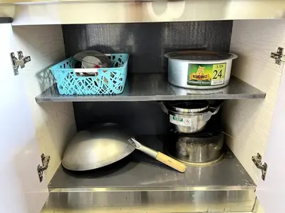 a shelf in a kitchen with a spoon and other items at Azzalea Homes 6 @ Taman Golden Hills Cameron Highlands in Tanah Rata