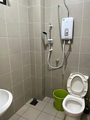 a bathroom with a toilet and a sink at Azzalea Homes 6 @ Taman Golden Hills Cameron Highlands in Tanah Rata