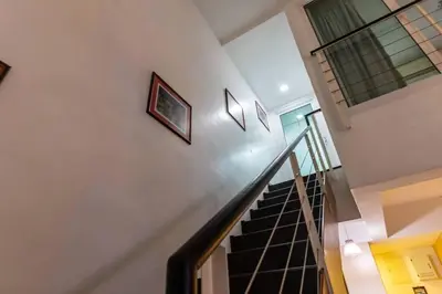 a staircase in a house with a stair case at 2Bedrooms Maritime Luxury Seaview Suite 2-10pax in Jelutong