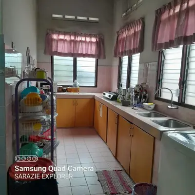 a kitchen with a sink and a counter top at LOST WORLD OF TAMBUN HOMESTAY in Kampong Batu Lapan