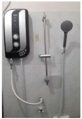 a shower in a bathroom with aperature at LOST WORLD OF TAMBUN HOMESTAY in Kampong Batu Lapan