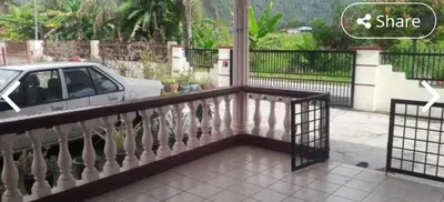 a balcony of a house with a car on it at LOST WORLD OF TAMBUN HOMESTAY in Kampong Batu Lapan