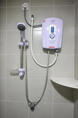 a shower in a bathroom with a pink machine at Moonight Luxe Suite, Cameron's Emerald Avenue in Brinchang