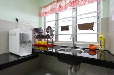 a kitchen counter with a sink and a window at Moonight Luxe Suite, Cameron's Emerald Avenue in Brinchang