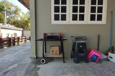 a room with a cart with boxes and a window at 5 Bedroom 2 Bathrooms End-lot House, 3 parkings - Ipoh, Tambun in Ipoh