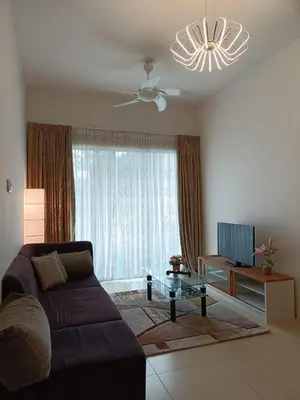 a living room with a couch and a tv at Alyaleesya homestay muslim night market in Brinchang