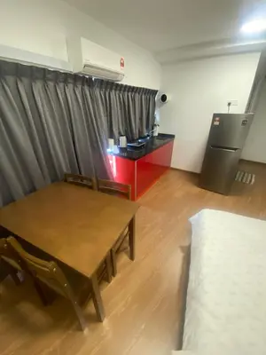 a room with a table and a couch and a kitchen at 6 PAX 1 BEDROOM SOHO near SPICE ARENA PANTAI SPECIALIST AIRPORT in Bayan Lepas