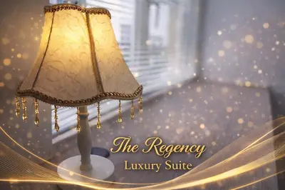 a lamp sitting on a table in a room at The Regency Luxury Suite -Gurney Strait Quay in Tanjong Tokong
