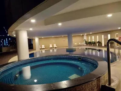 a large swimming pool in a hotel room at The Regency Luxury Suite -Gurney Strait Quay in Tanjong Tokong