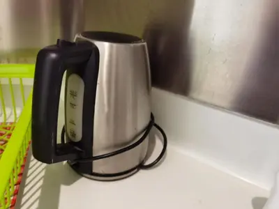 a coffee pot sitting on top of a counter at The Regency Luxury Suite -Gurney Strait Quay in Tanjong Tokong