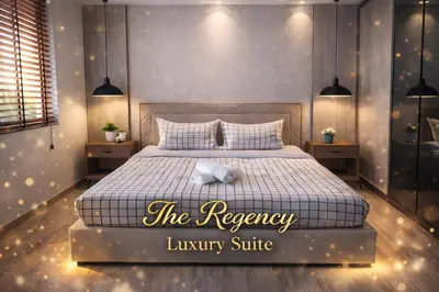 a bedroom with a king sized bed with a luxury suite at The Regency Luxury Suite -Gurney Strait Quay in Tanjong Tokong