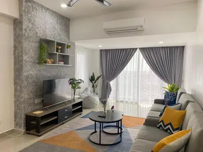 a living room with a couch and a tv at \u4f11\u95f2\u6c11\u5bbf Leisure Homestay @The Venus Sitiawan in Kampong Lumut Kiri