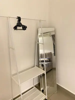 a camera on a shelf in a room at \u4f11\u95f2\u6c11\u5bbf Leisure Homestay @The Venus Sitiawan in Kampong Lumut Kiri