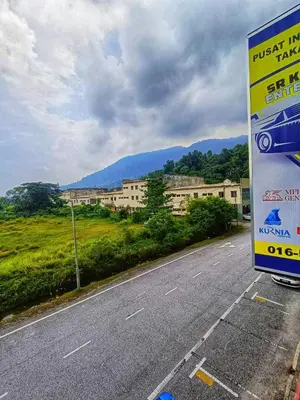 a truck is parked on the side of a road at SR Kampar Homestay, Bandar Baru Kampar in Kampar