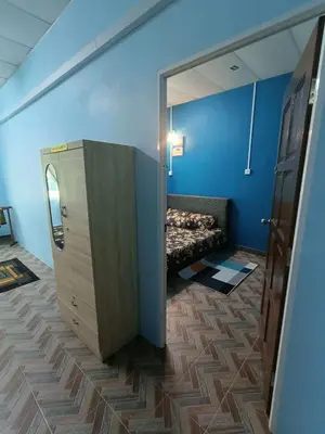 a room with a bed in the corner of a room at SR Kampar Homestay, Bandar Baru Kampar in Kampar