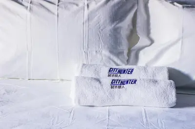 a pile of towels sitting on top of a bed at CITY HUNTER At Georgetown in George Town