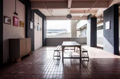 a table and chairs in a room with a large window at CITY HUNTER At Georgetown in George Town