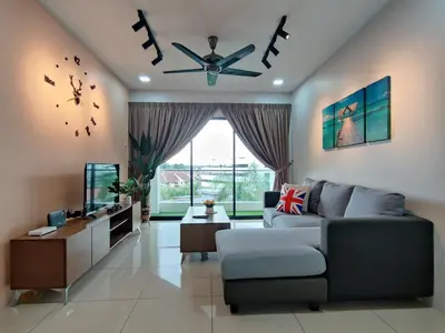 a living room with a couch and a ceiling fan at PoolView Waterpark 300Mbps Ipoh Homestay Manhattan Condo 4-7pax 3bedroom Station 18 pengkalan in Ipoh