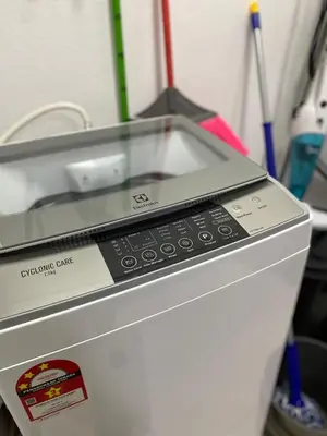 a close up of a cash register with a phone on it at PoolView Waterpark 300Mbps Ipoh Homestay Manhattan Condo 4-7pax 3bedroom Station 18 pengkalan in Ipoh
