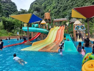 a group of people playing in a water park at Sunway Onsen Theme Park View @Lost World of Tambun in Ipoh