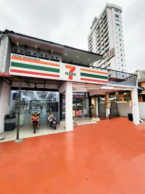 a gas station with two motorcycles parked in it at Gurney Coast Guest House by Sky Hive in George Town