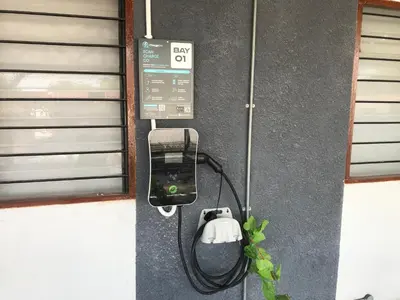 a pay phone is attached to a wall at Ipoh Family Homestay Masjid Muhammadiah Evicharger SY16 in Ipoh